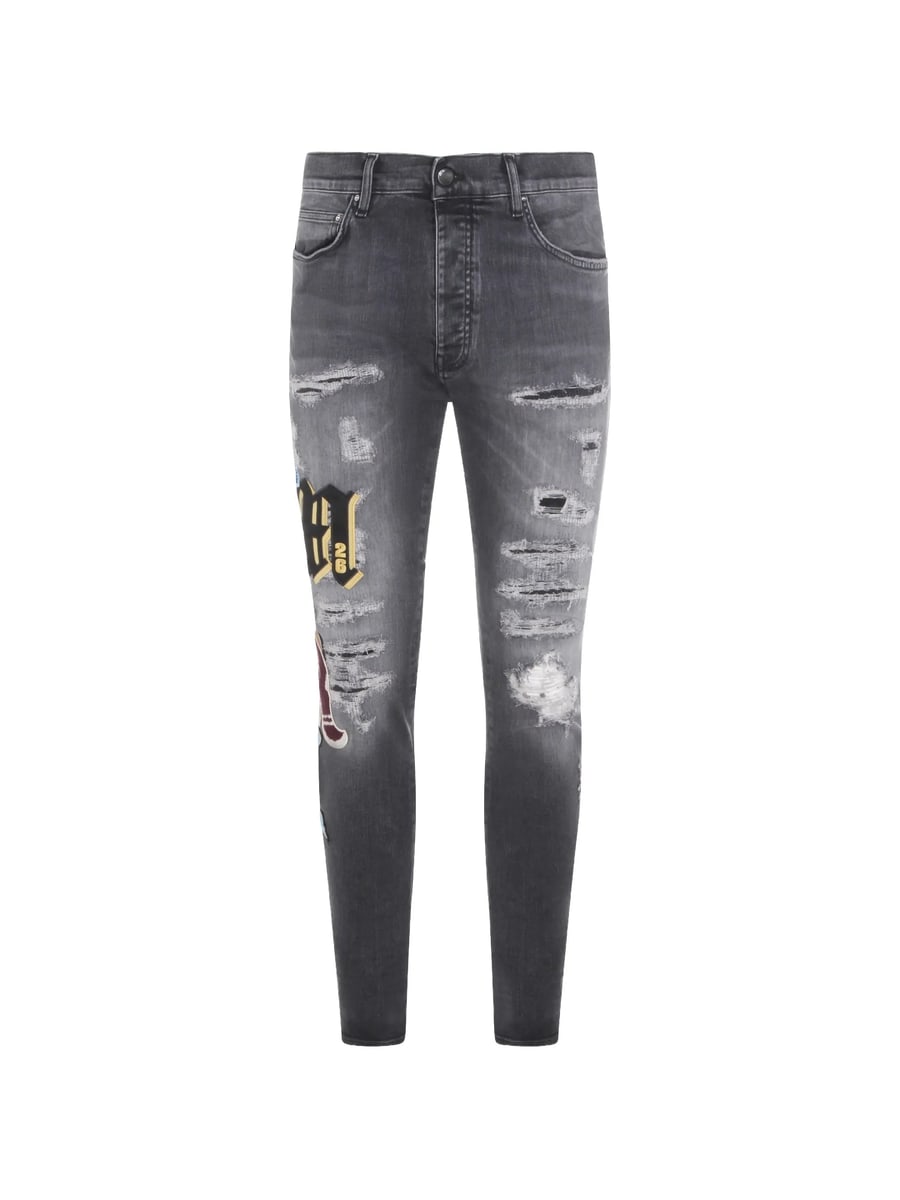 Amiri Amiri Ripped Patch Skinny Jeans