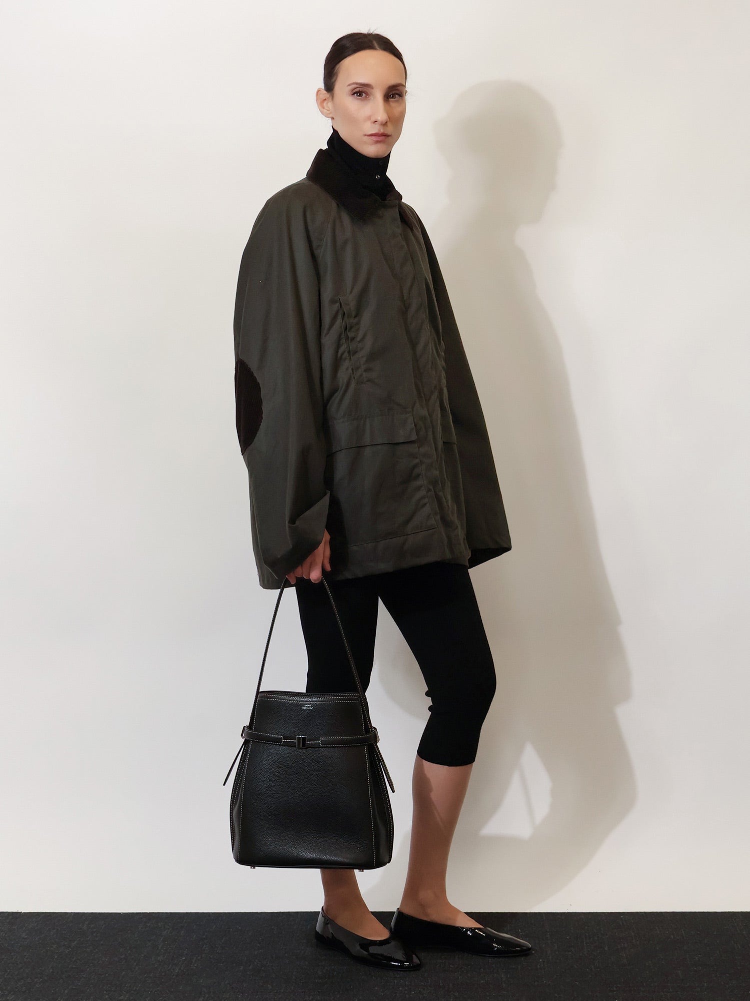 Toteme Hammered leather bucket bag with strap on the front, view 2