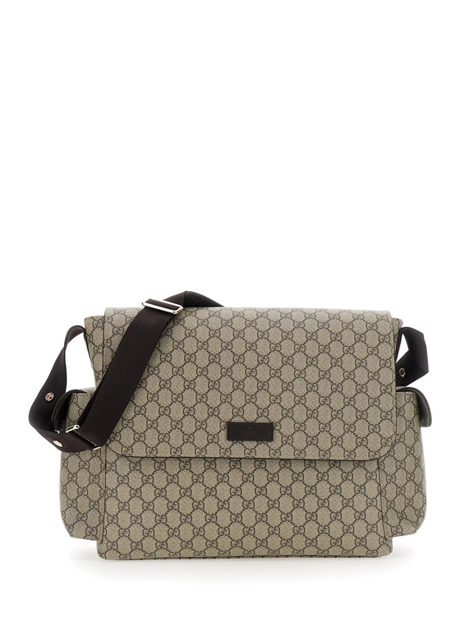 Gucci kids Borsa a tracolla fasciatoio con tracolla regolabile e chiusura con patta sul fronte in tela GG Supreme beige baby